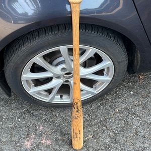 Louisville slugger wooden baseball bat.
